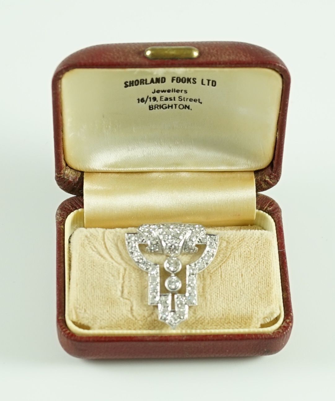 A 1930's Art Deco white gold and diamond cluster openwork clip brooch
